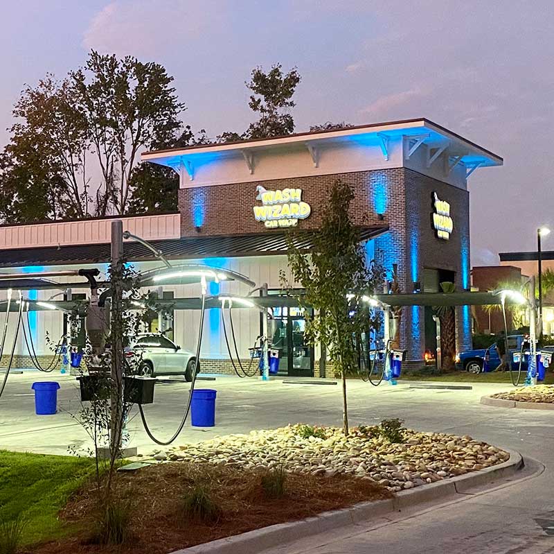 https://washwizardcarwash.com/wp-content/uploads/2020/11/NM-Building-Cyan-Night-Square.jpg